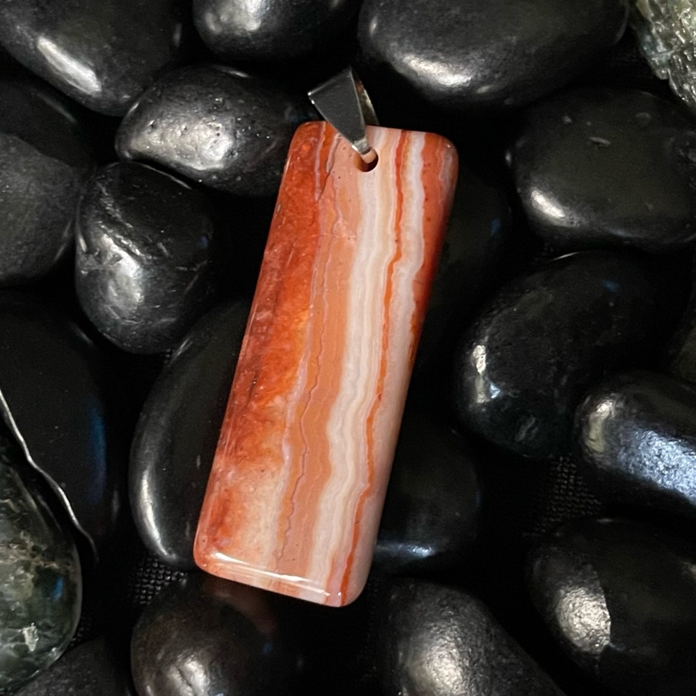 Carnelian Agate Pendant 1 1/2x3/4”. Natural Stone. Makes for a beautiful gift.